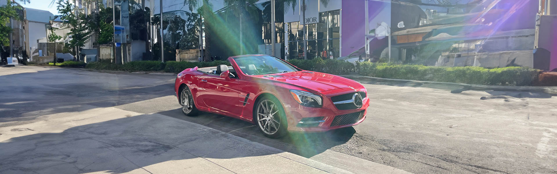 Mercedes convertible cruising on Rodeo Drive